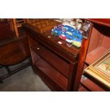 A reproduction mahogany open fronted bookcase