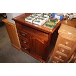 A hardwood cabinet fitted three short drawers