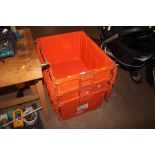 Three plastic storage crates