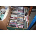 A box of various CDs