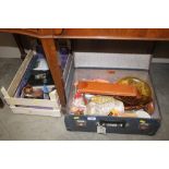 A suitcase and a box containing various dolls; met