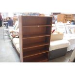 A teak effect open fronted bookcase