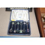 A cased set of souvenir spoons