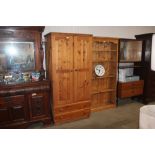 A pine double wardrobe fitted two drawers below