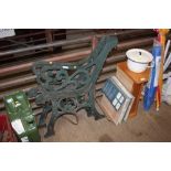 A pair of metal bench ends