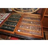 Two display cases and contents of souvenir spoons