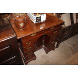 A George III mahogany knee hole desk fitted two sh