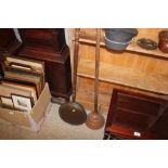 An old copper and wooden handled wash dolly; and a