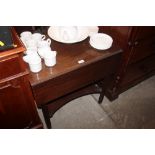 A mahogany drop leaf two tier table