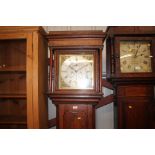 An oak long case clock with brass spindrel dial an