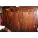 A stained pine single door wardrobe