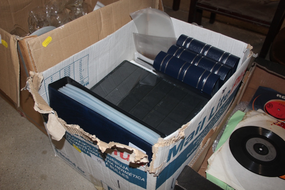 A box of empty albums; stock cards and leaves etc.