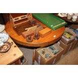 A reproduction mahogany extending dining table