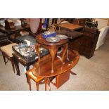 A reproduction yew wood oval coffee table and vari