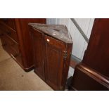 An antique oak hanging corner cupboard - key on ro