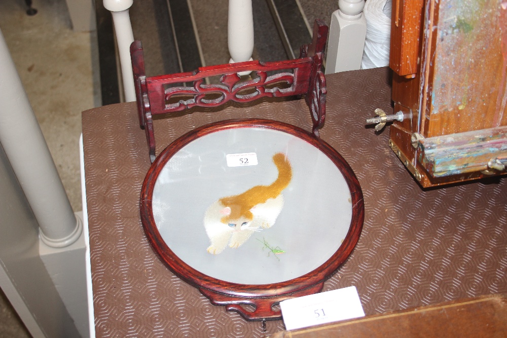 A Chinese painted glass table screen decorated wit