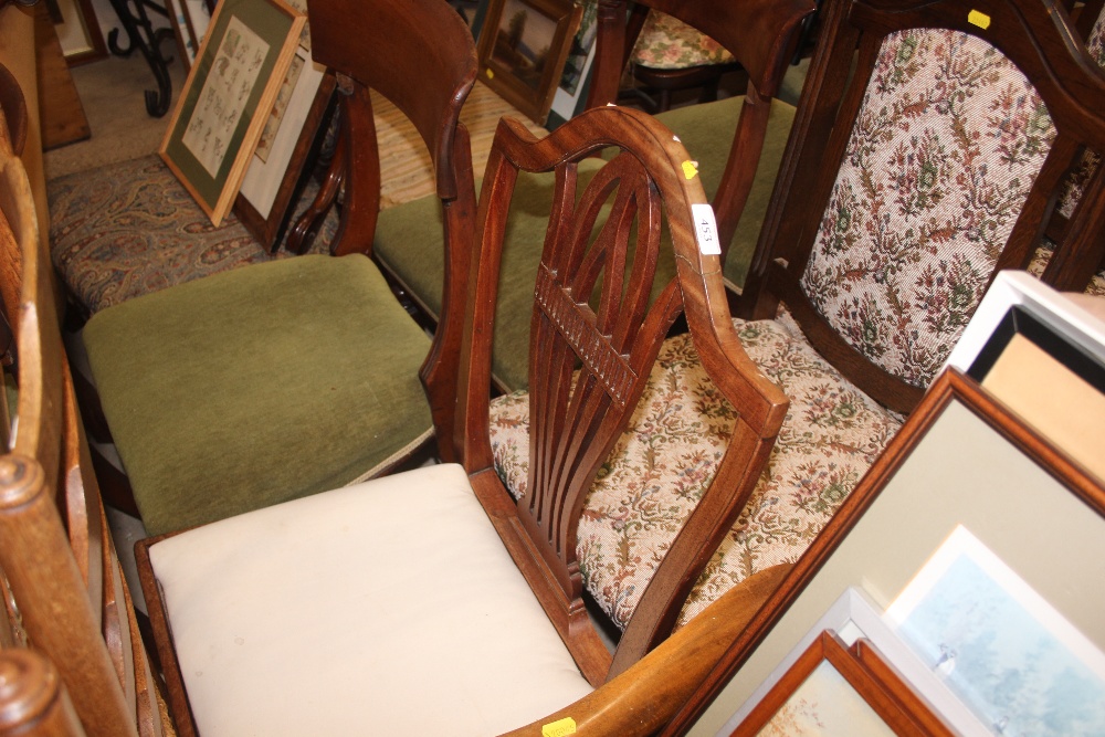 A mahogany slat back dining chair