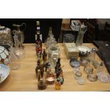 A collection of various miniatures; decanters; tan
