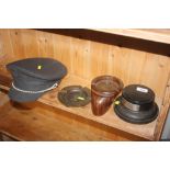 Two ash trays; a trophy plinth and a hat