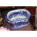 A large blue and white transfer printed foot bath