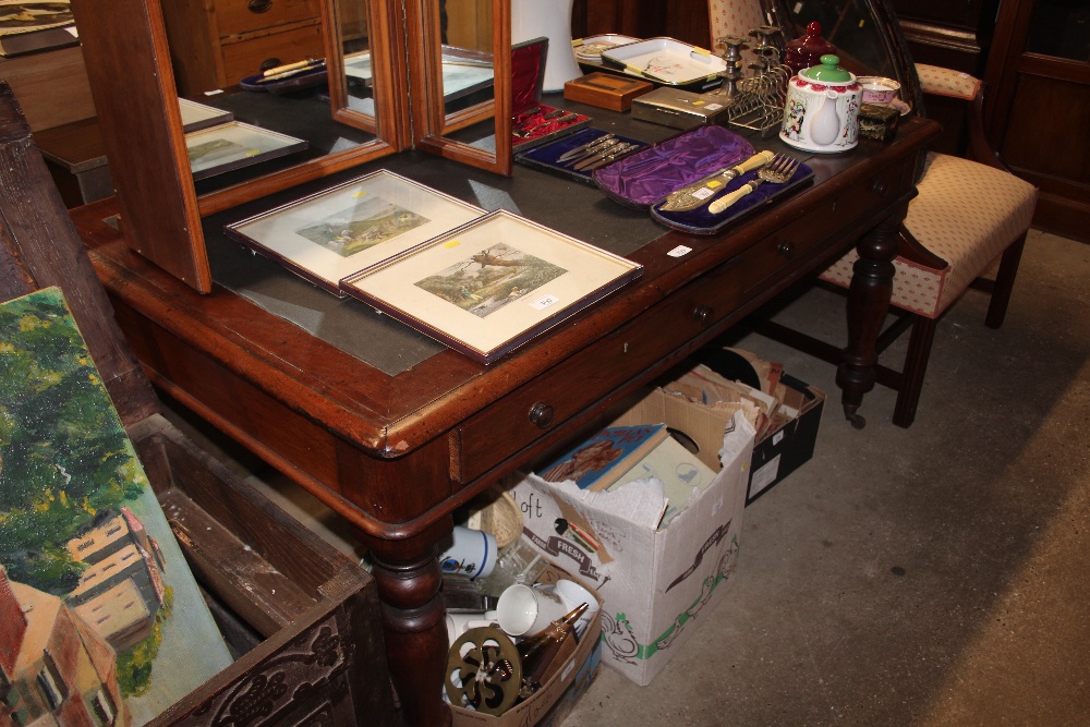 A Victorian mahogany writing table fitted four opp