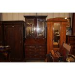 A George III mahogany bureau bookcase, with mirror