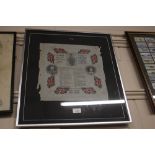 A framed souvenir napkin 'Prince of Wales Silver J