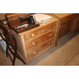 A stripped pine chest fitted three long drawers