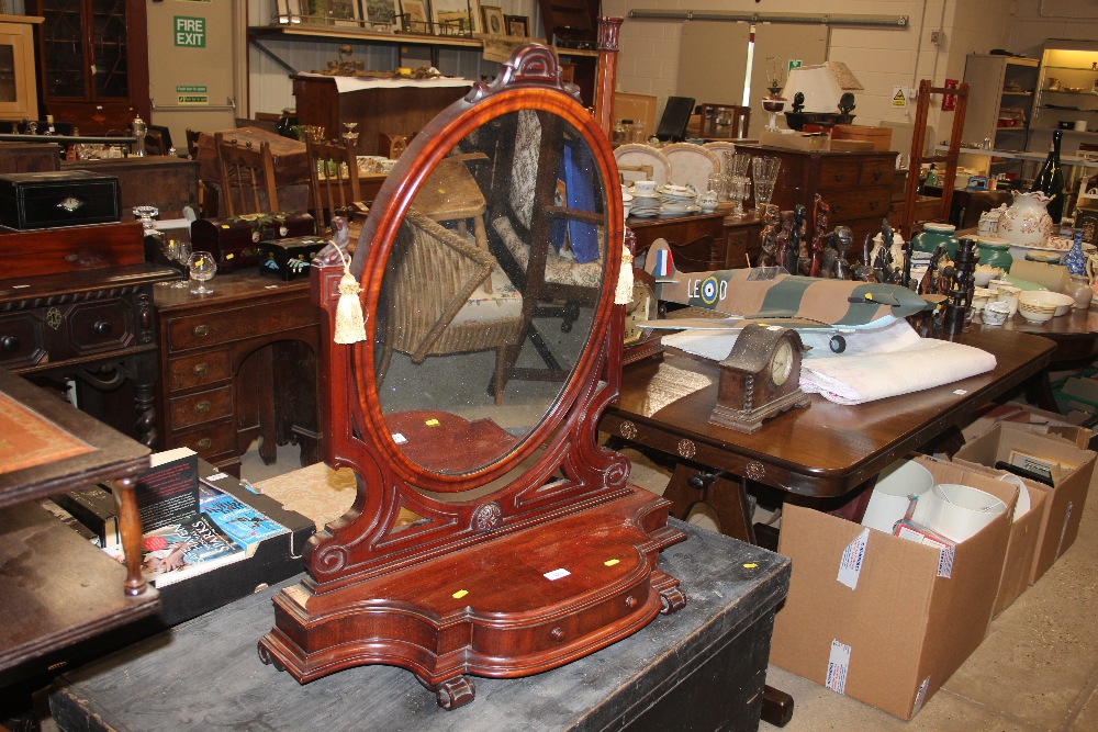 A Victorian mahogany swing framed mirror