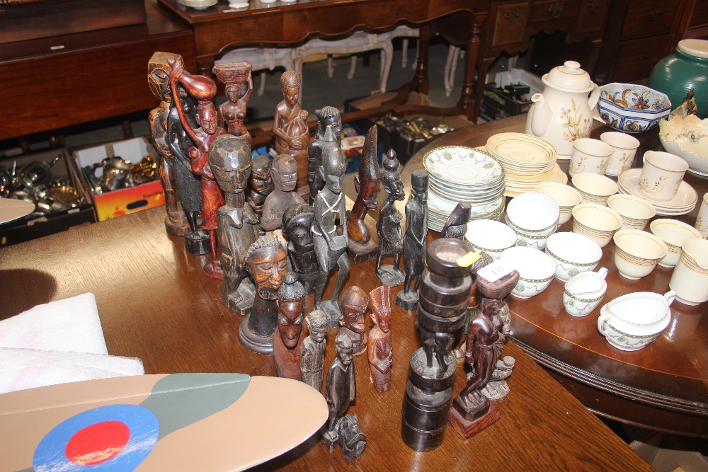 A collection of various carved African ornaments a