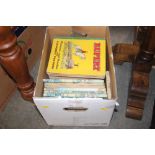 A box of various Rupert Bear annuals