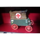 A wooden model of a horse drawn WW1 ambulance