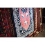An approx. 6' x 3' blur patterned rug