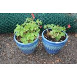 Two blue glazed planters and contents