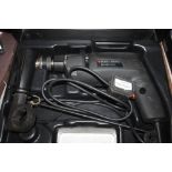 A Black & Decker electric drill in fitted case