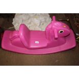 A child's Little Tikes rocking horse