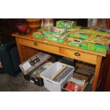 A pine table fitted two drawers