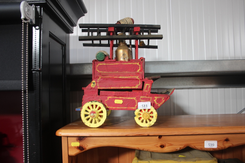 A wooden model of a horsedrawn fire engine