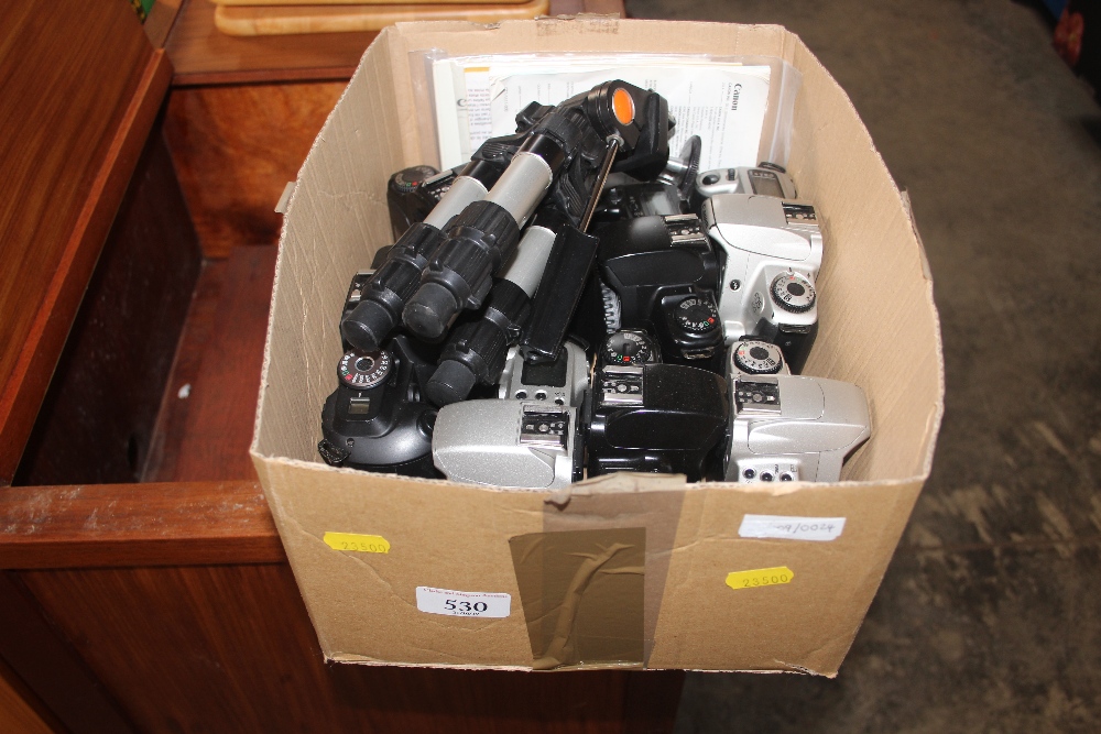 A box of various cameras etc.