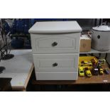 A modern two drawer bedside chest