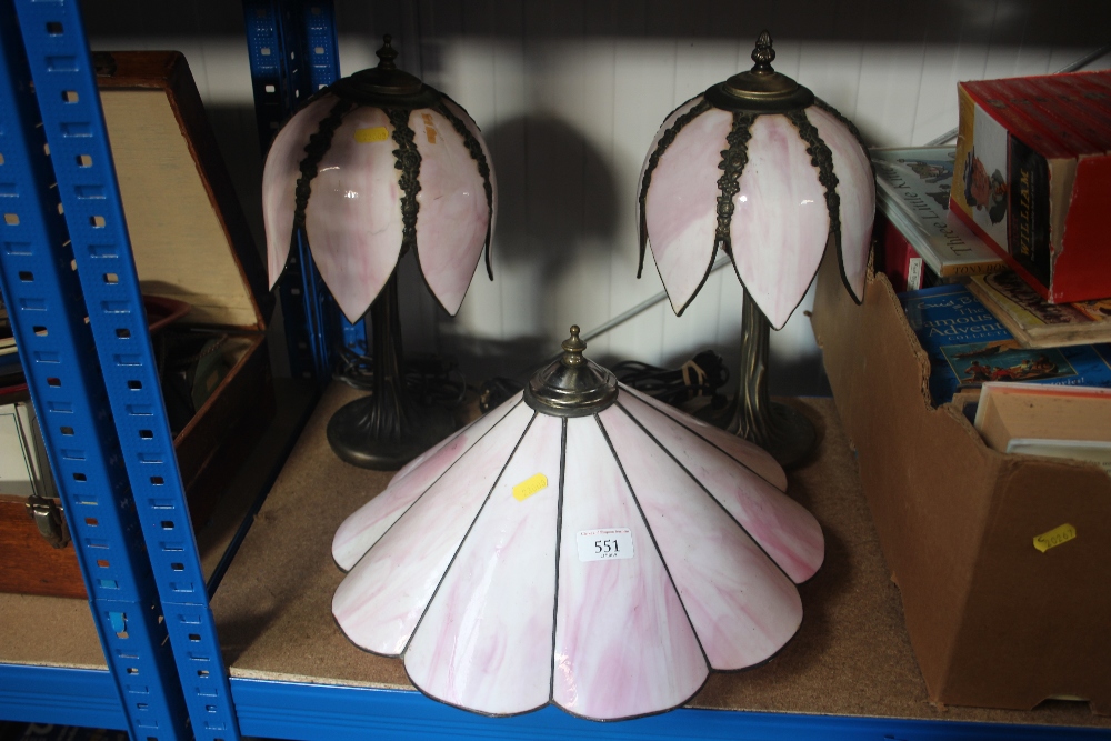 A pair of table lamps with pink shades; together w