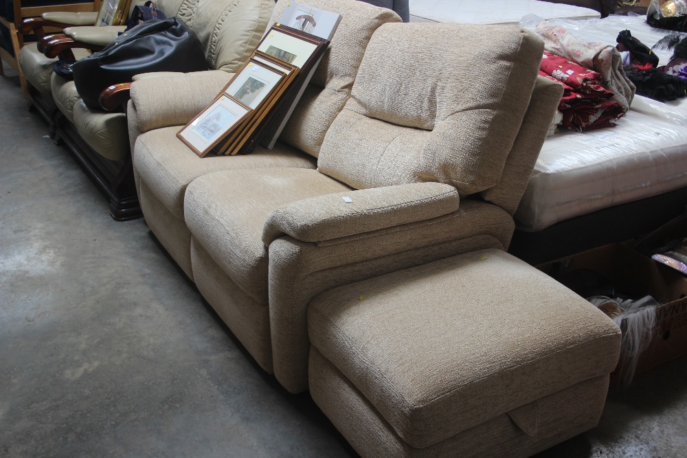 A cream upholstered two seater settee with matchin