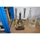 Two pairs of brass candlesticks; brass bell; small