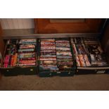 Three boxes of various DVDs