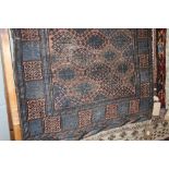 An approx. 5'7" x 3'3" blue patterned rug