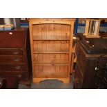 A pine open fronted bookcase