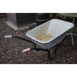 A galvanised wheel barrow