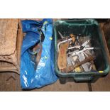 A bag and a plastic crate of various fittings and