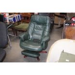 A green leather upholstered swivel chair