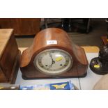 A two hole walnut cased mantle clock